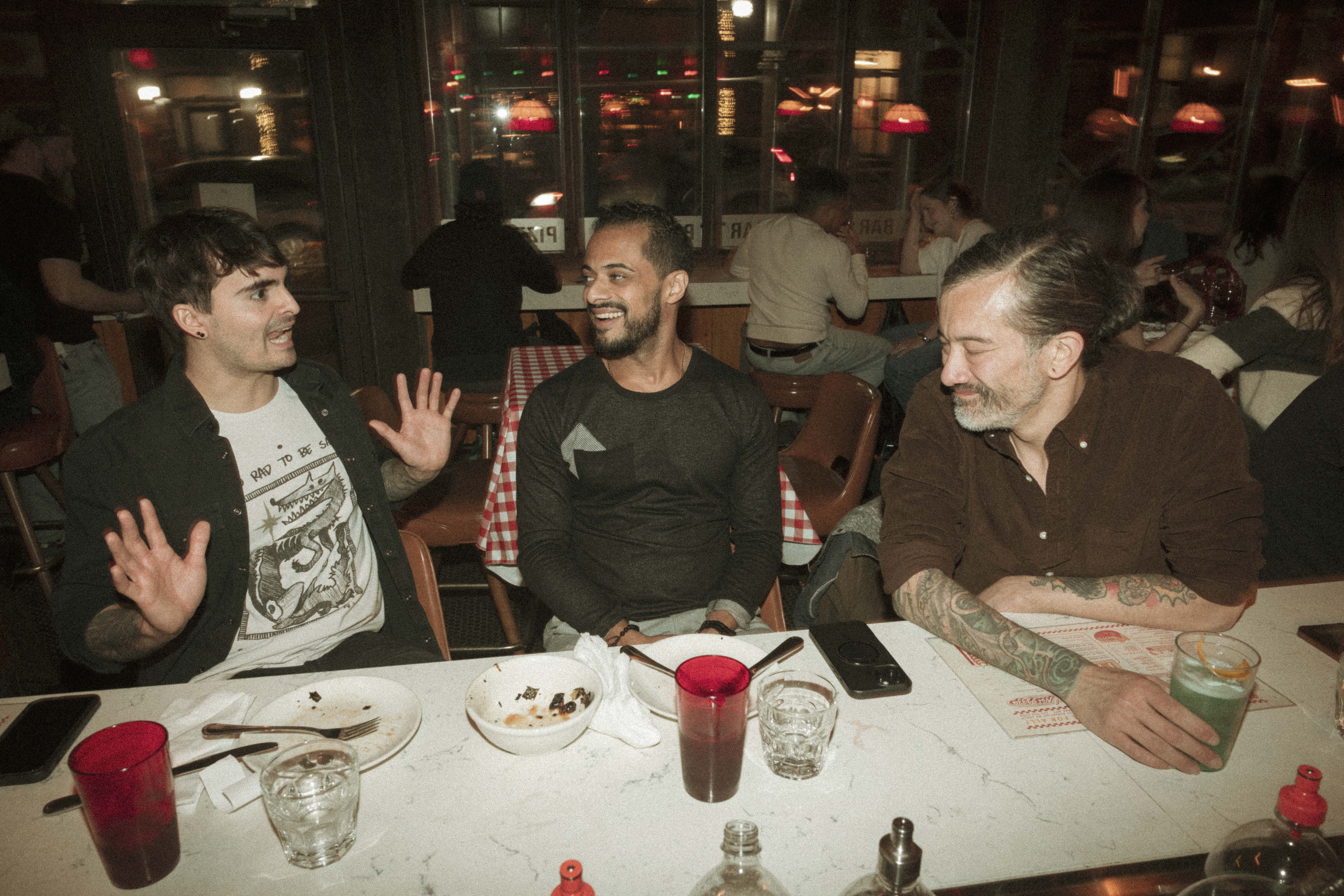 a group of men sitting at a table
