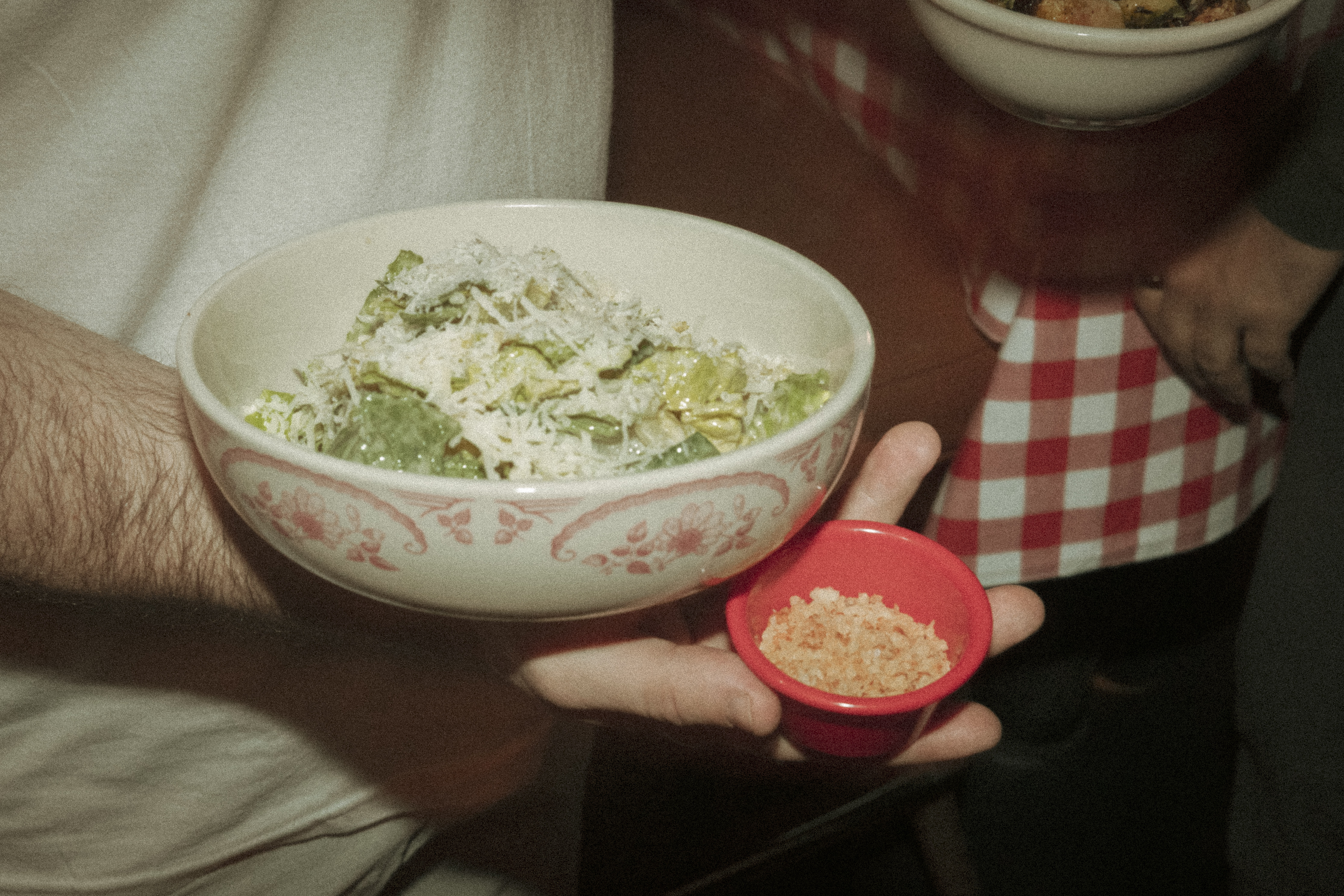 a person holding a bowl of food
