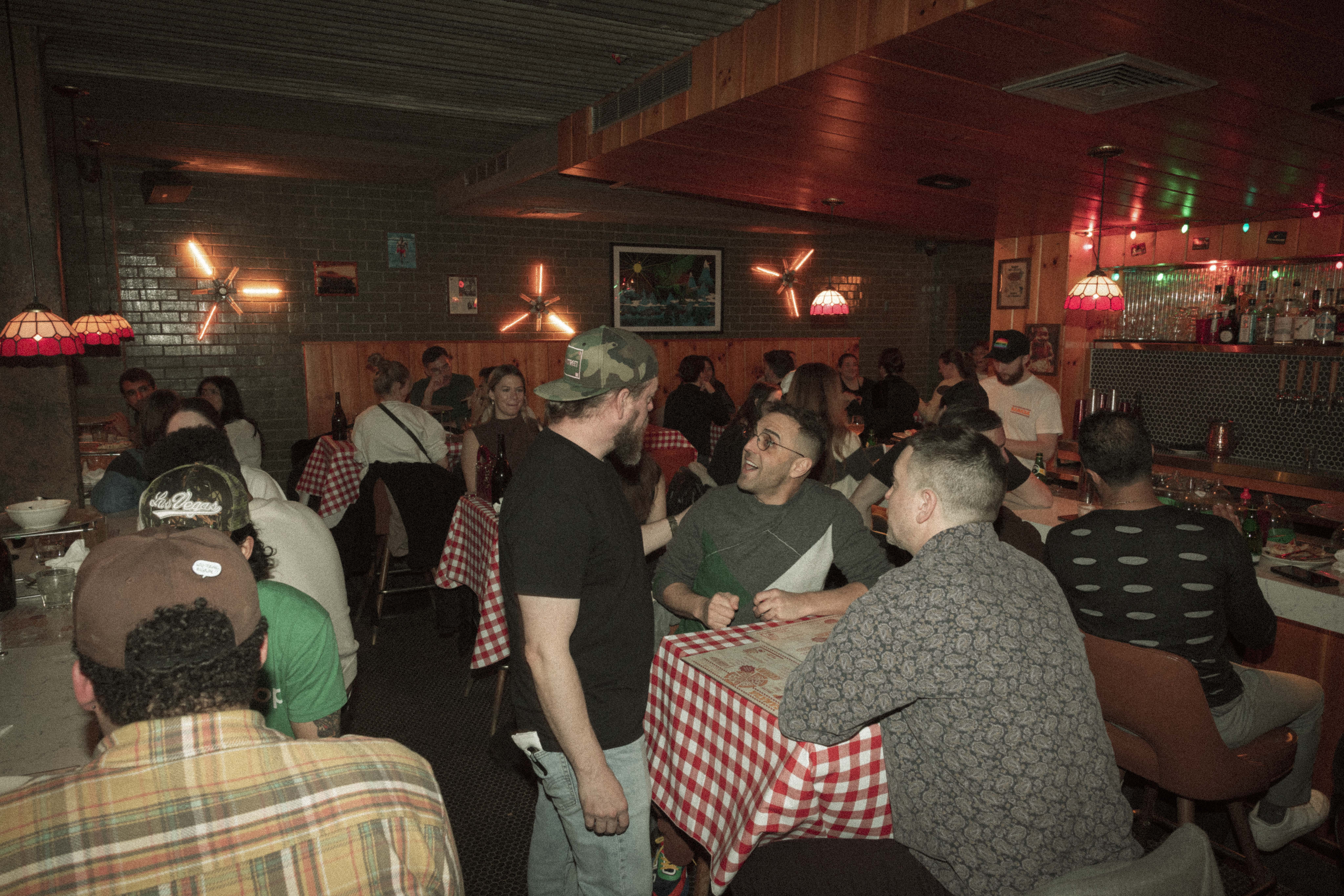 a group of people sitting at tables