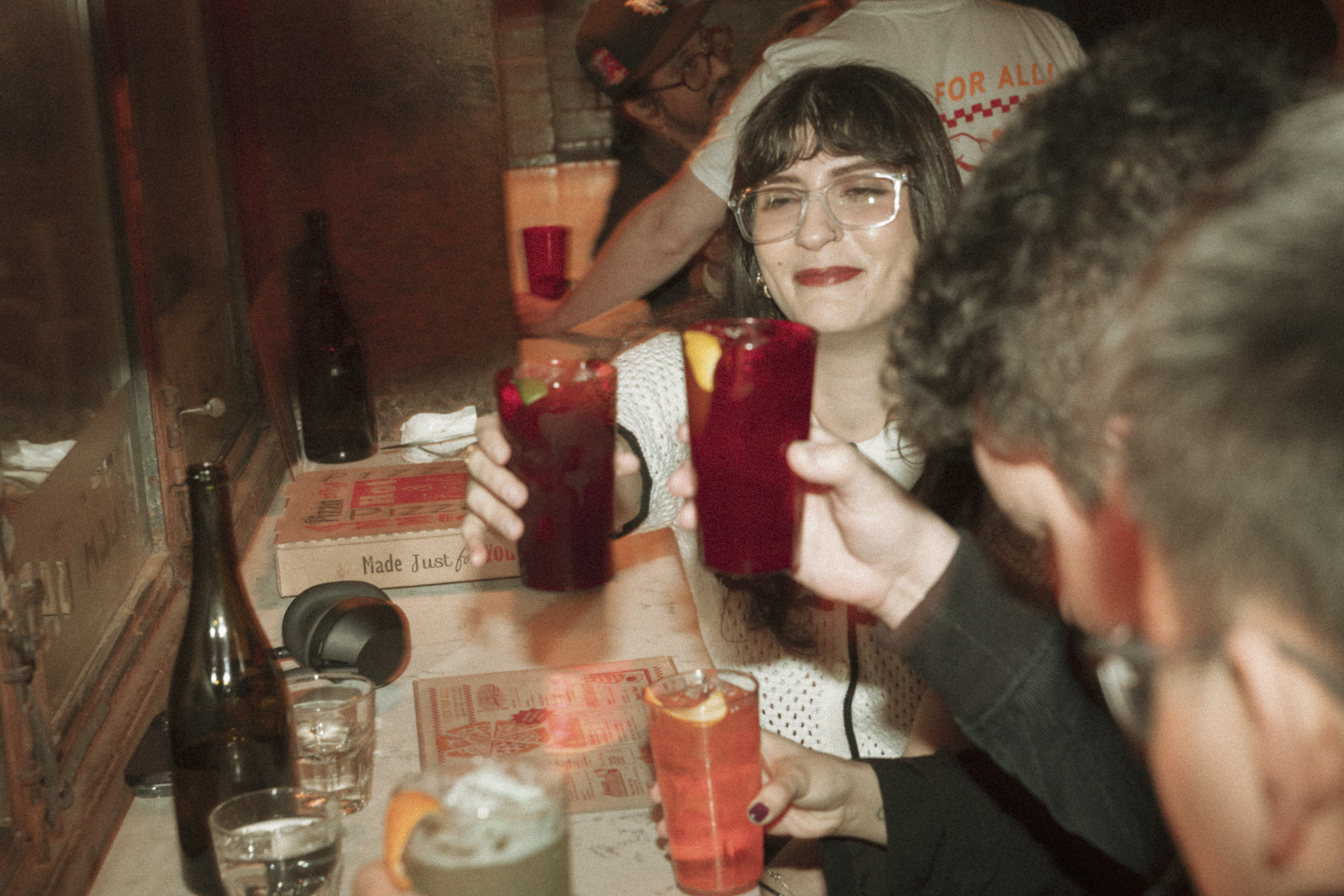 a group of people at a table with drinks
