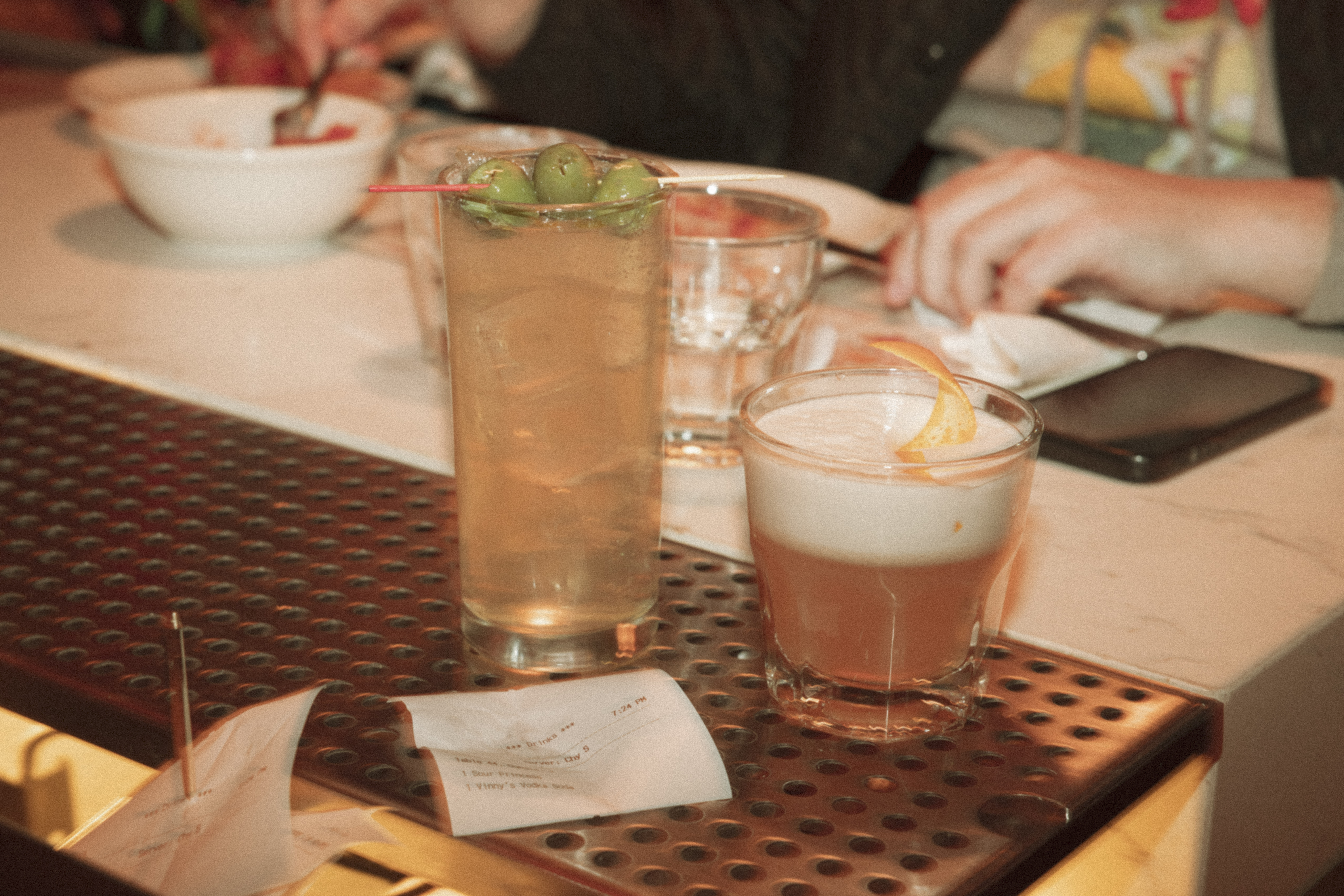 a group of glasses of drinks on a table