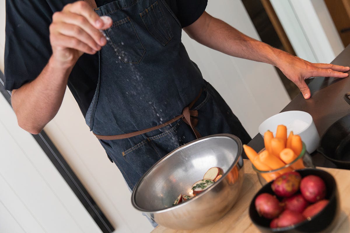 a person holding a bowl of food