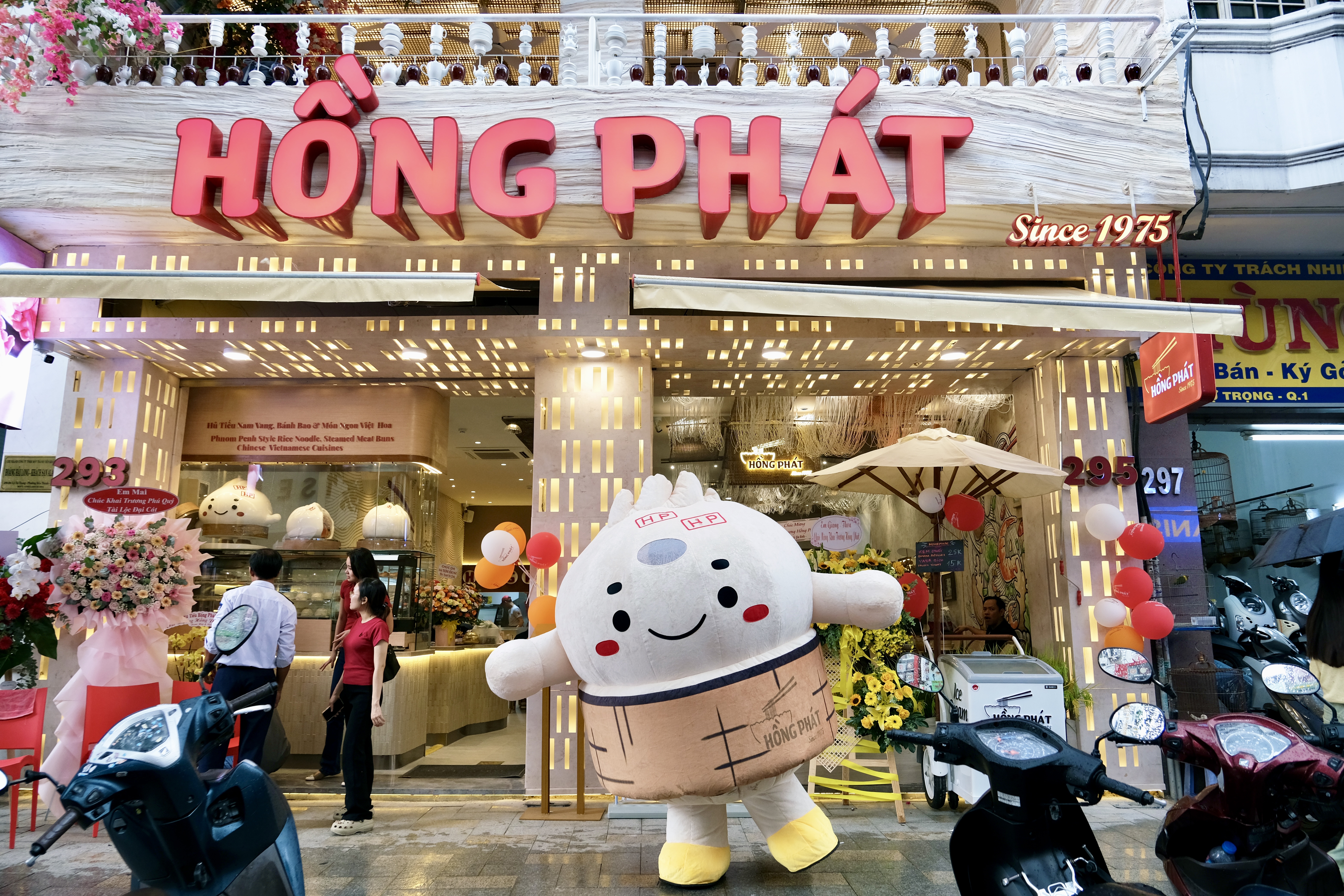 a group of people performing on stage in front of a building