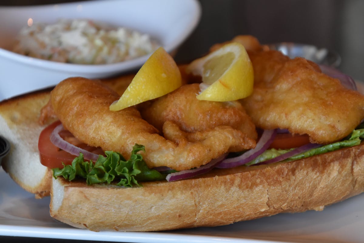 a sandwich sitting on top of a plate of food