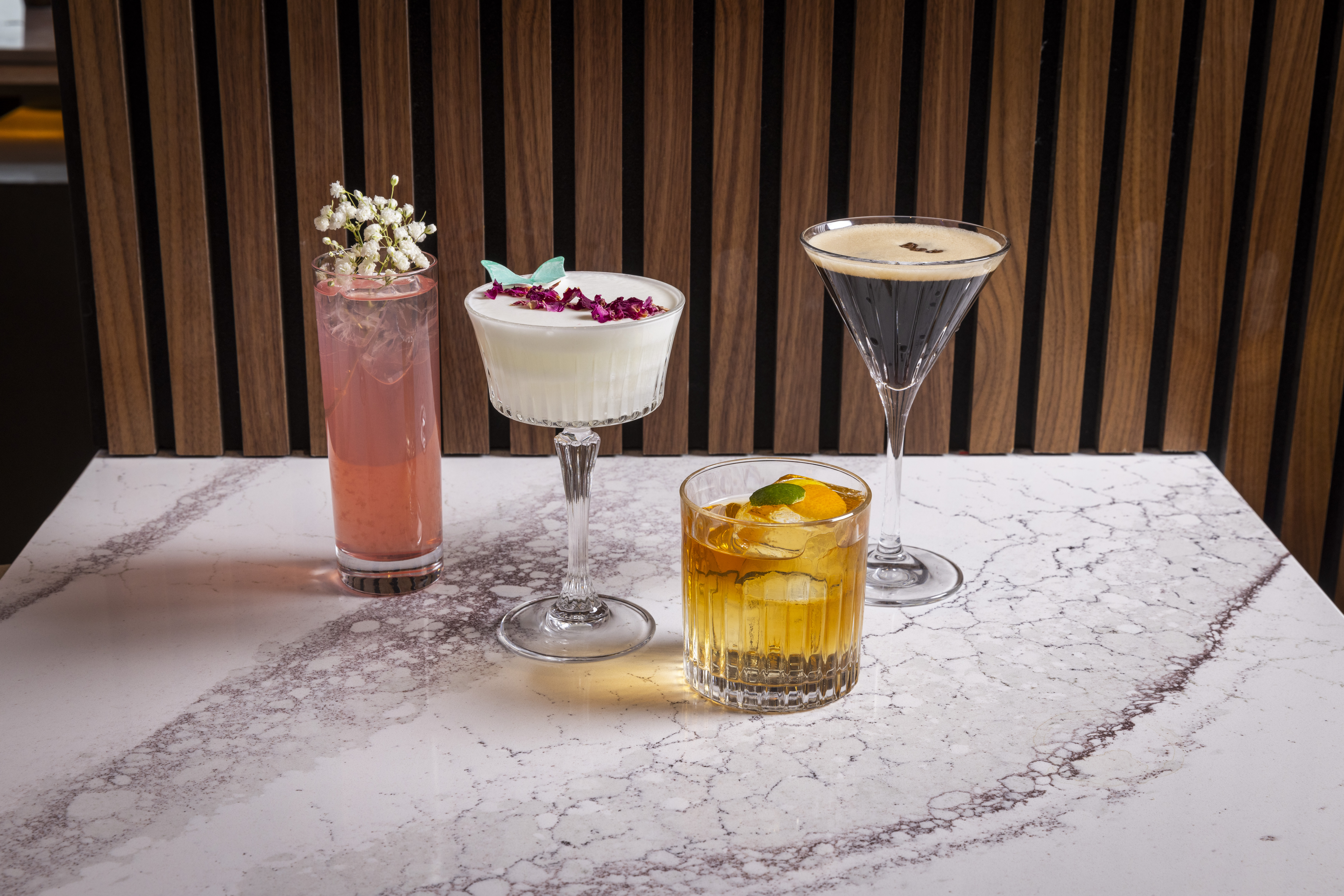 a glass of wine sitting on top of a table