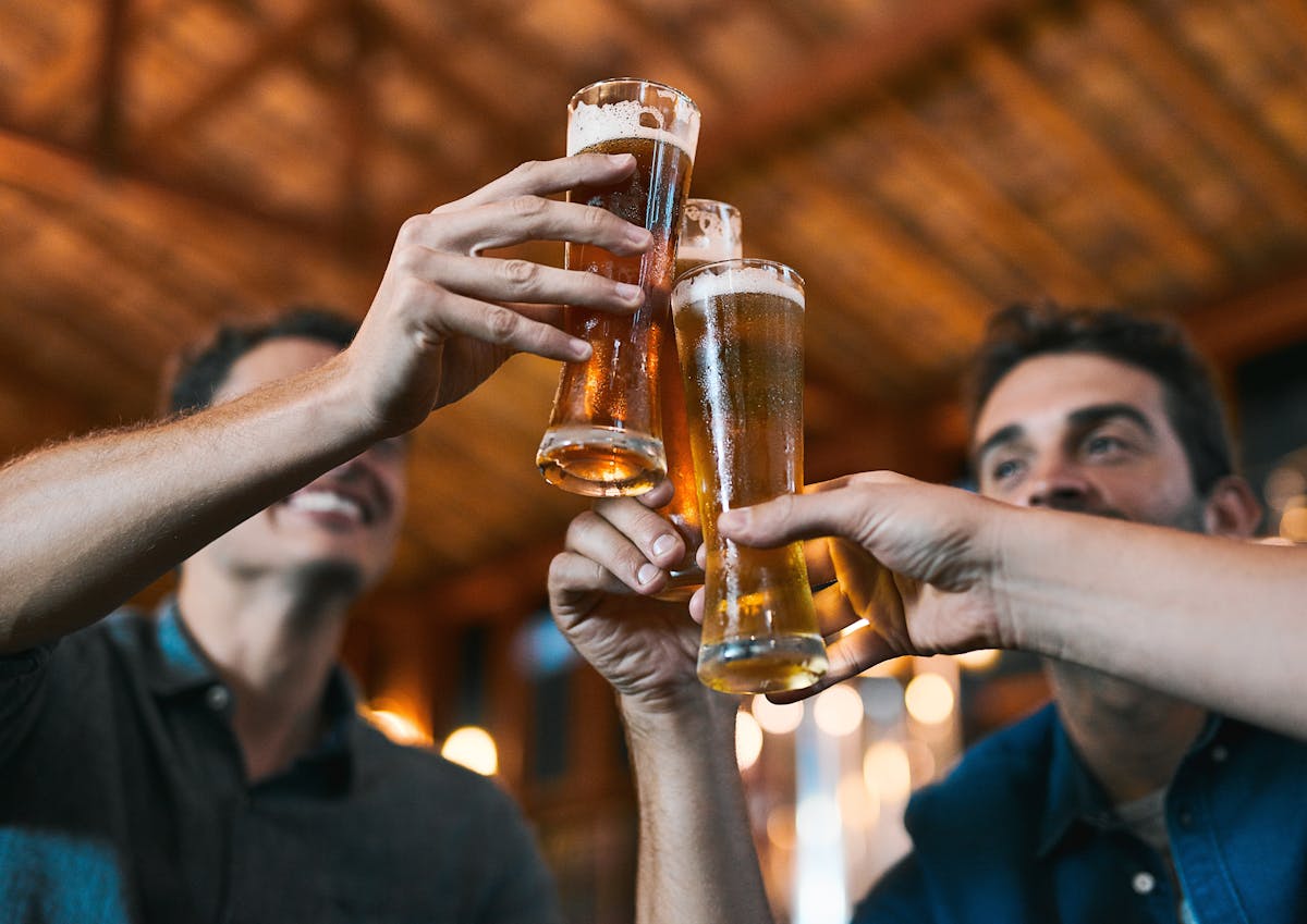 Friends toast beer