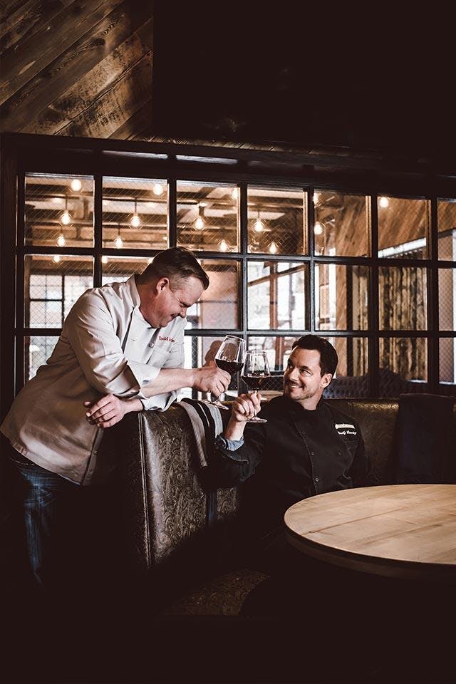 TIM AND TODD in a dining room