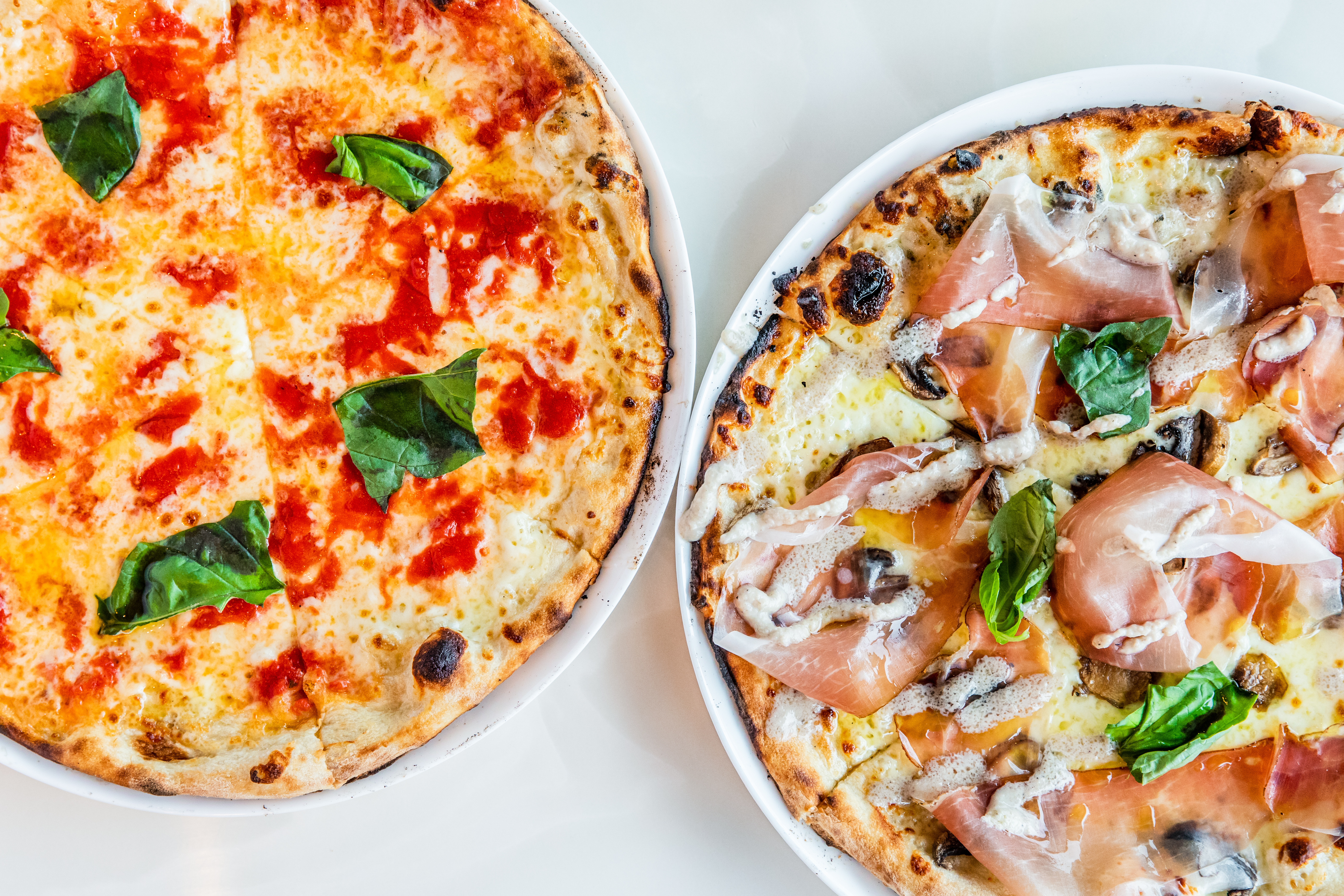a pizza sitting on top of a plate of food