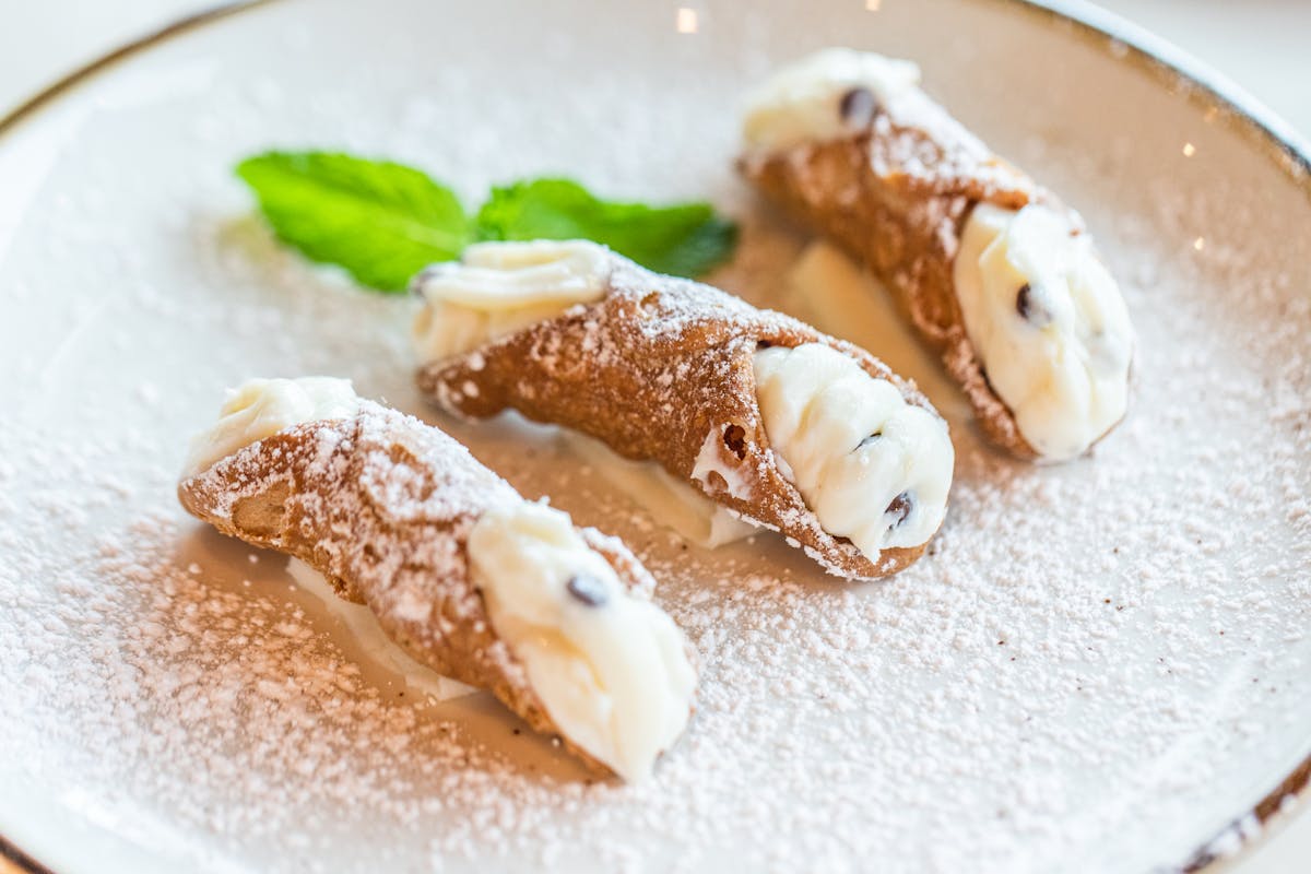 a plate of cannolis
