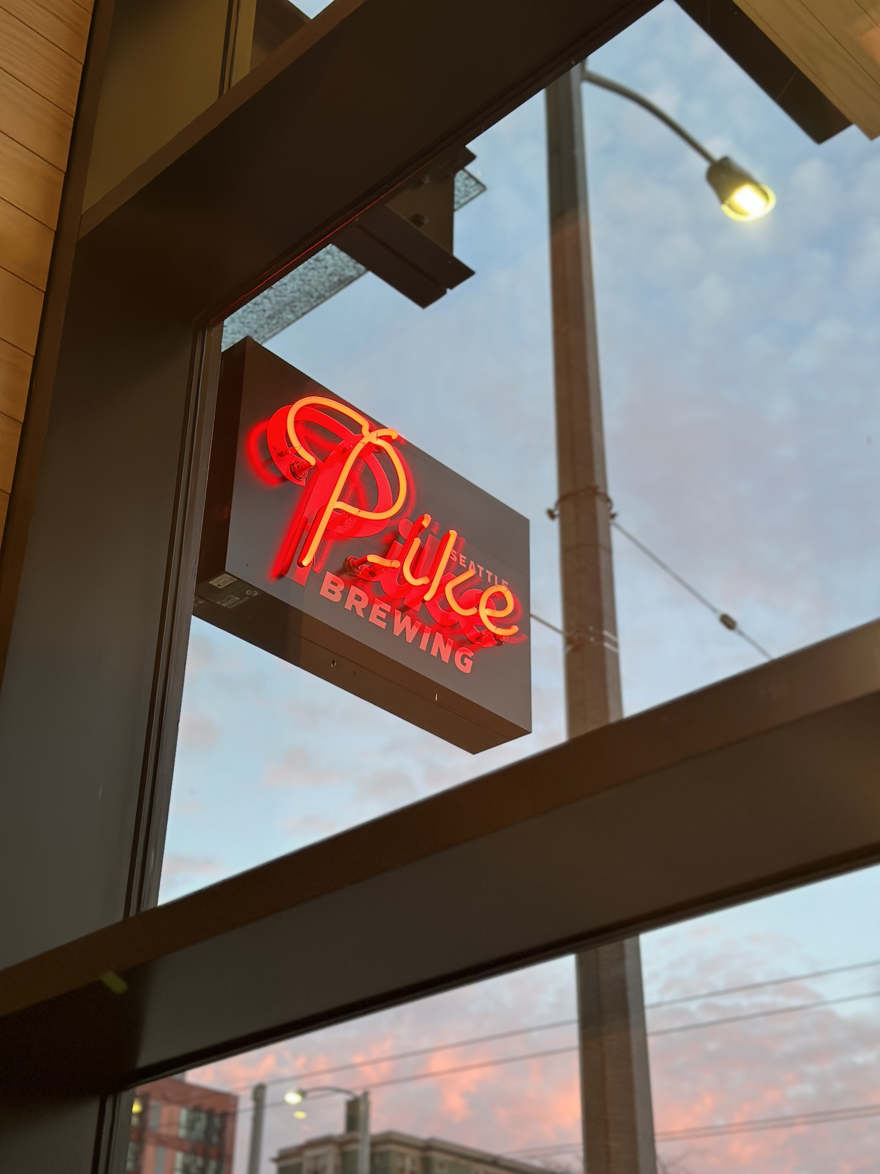 a sign hanging off the side of a building
