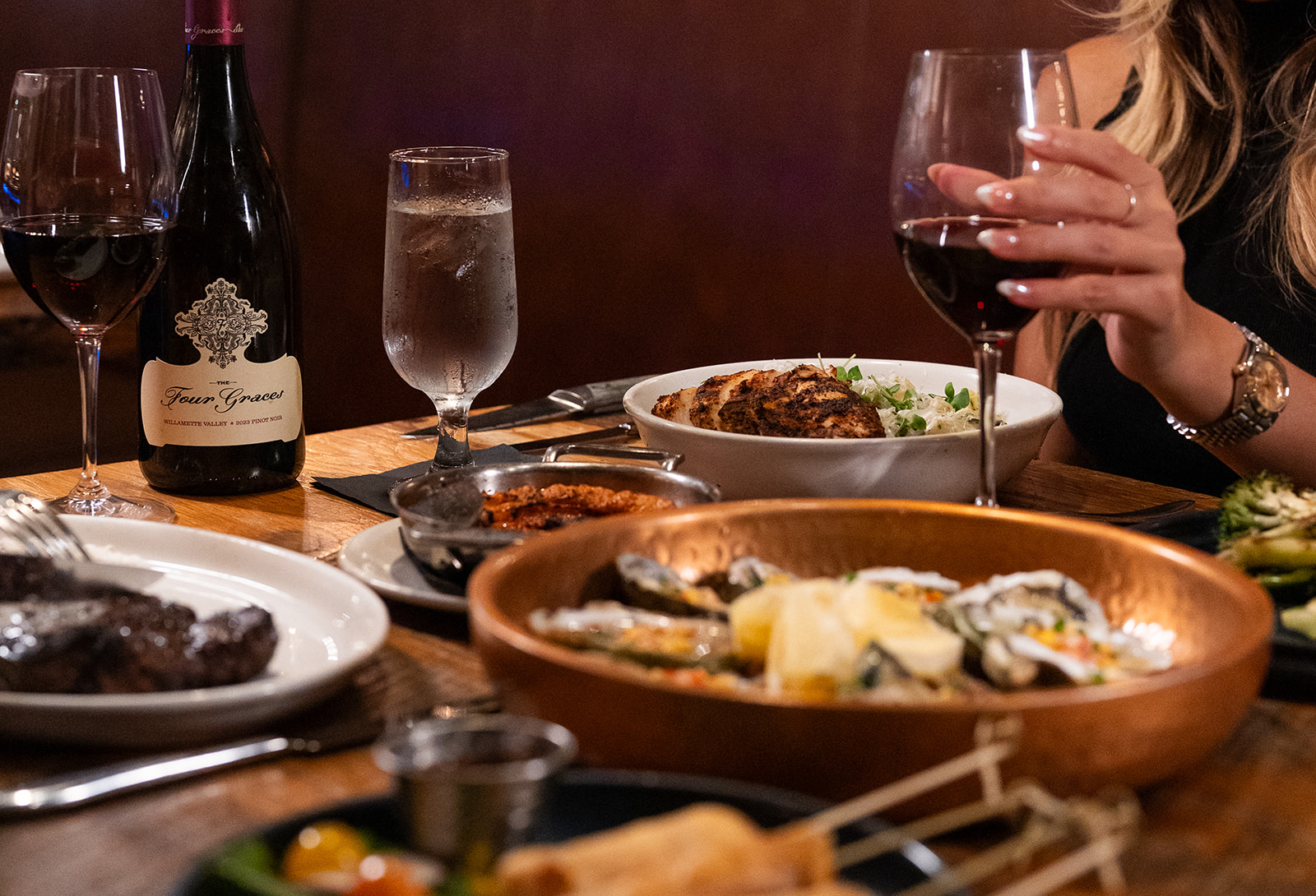 Couple having steak dinner with wine in tampa, florida steakhouse
