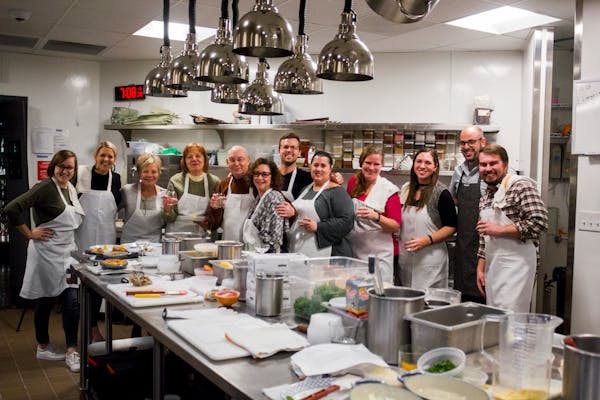 Kitchen of Wrigleyville neighborhood restaurant with cooking class participants