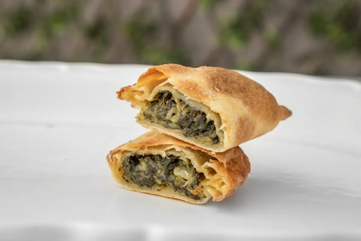 a close up look to two sliced empanadas