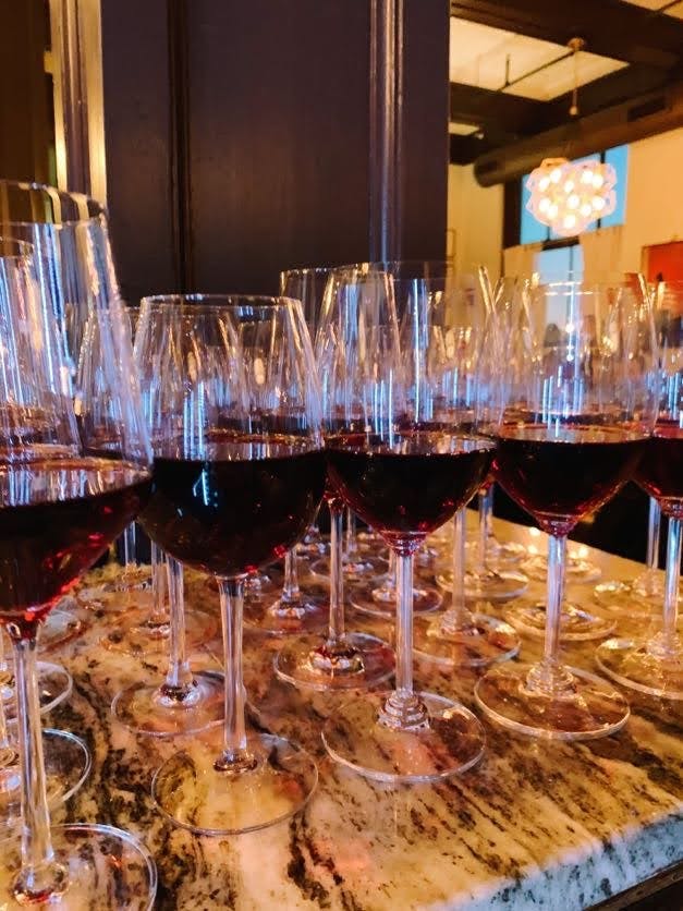 a table filled with wine glasses