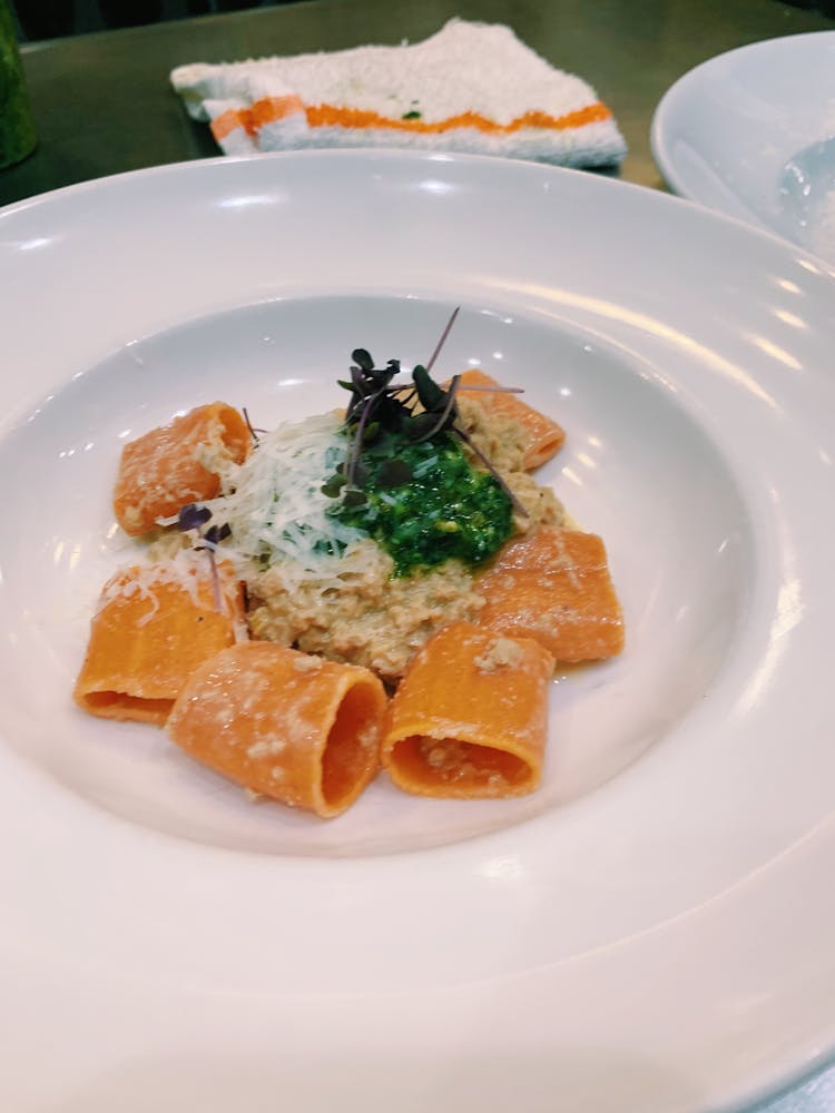 a plate of food with a slice of orange