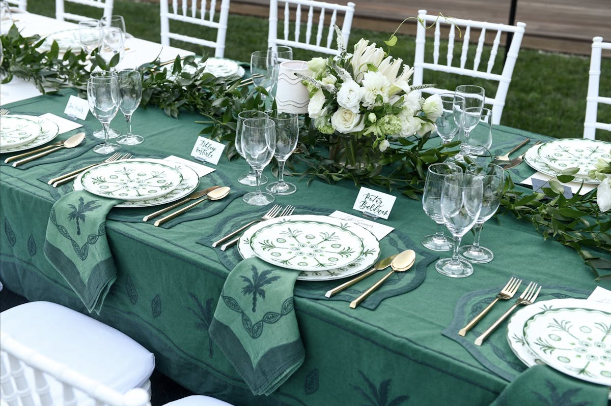 a table topped with lots of green leaves