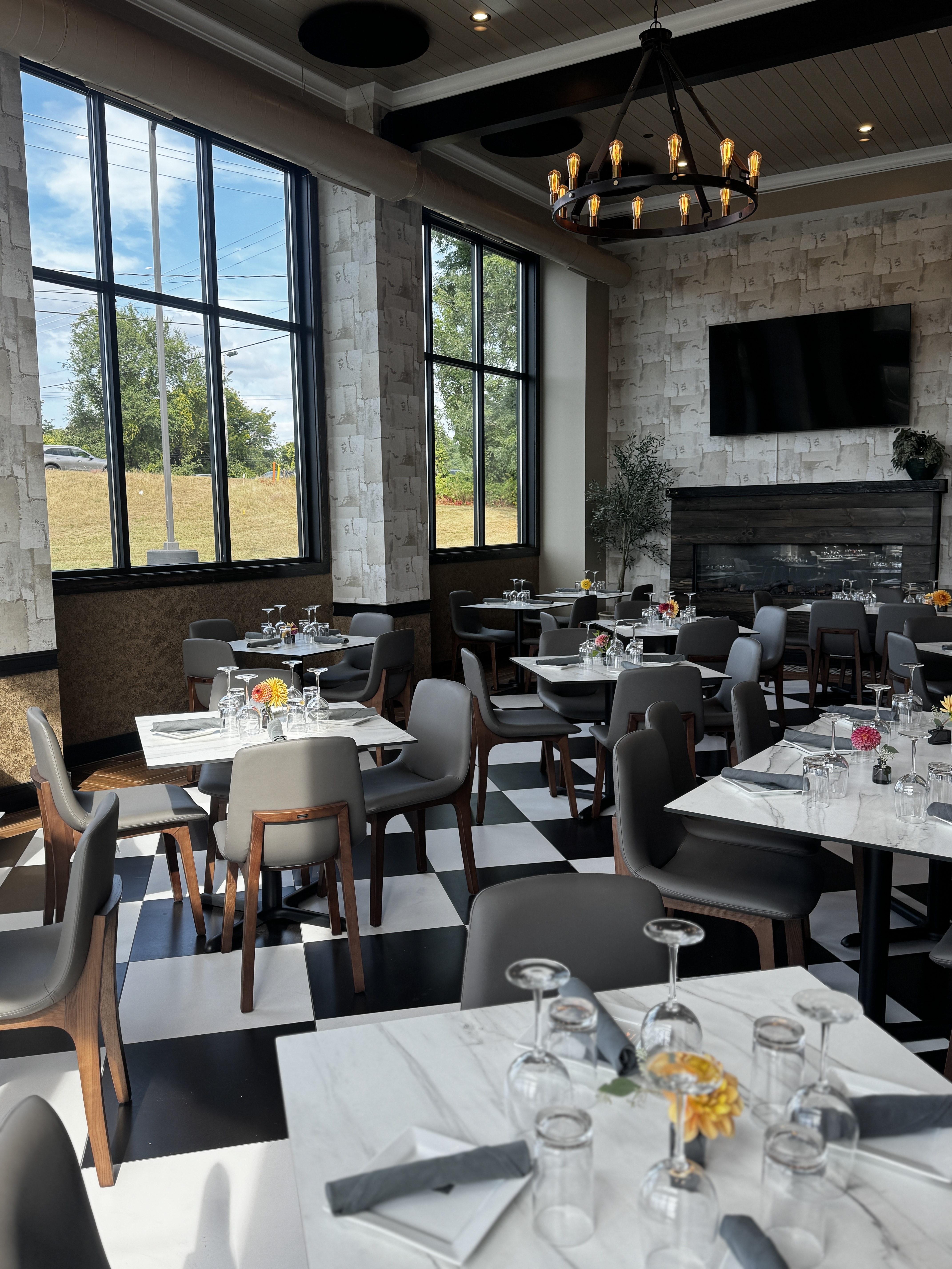 a room filled with furniture and a fire place and a dining table