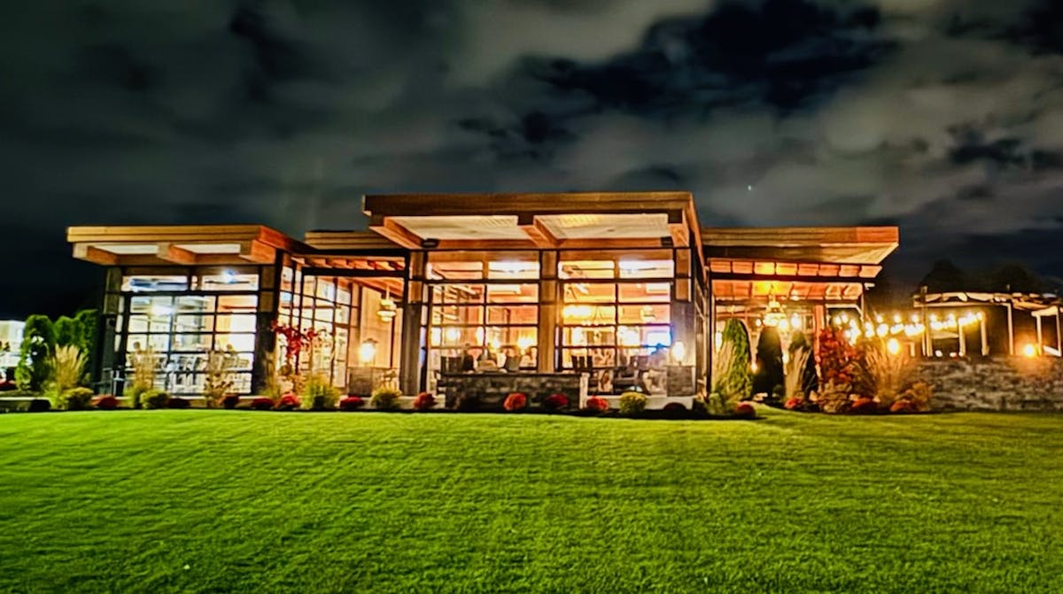 a building with a grassy field