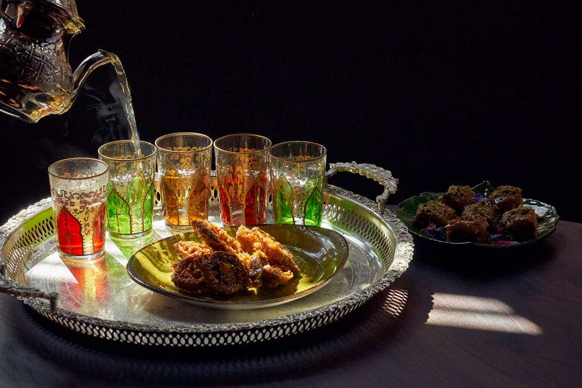 a set of glasses over a tray plate
