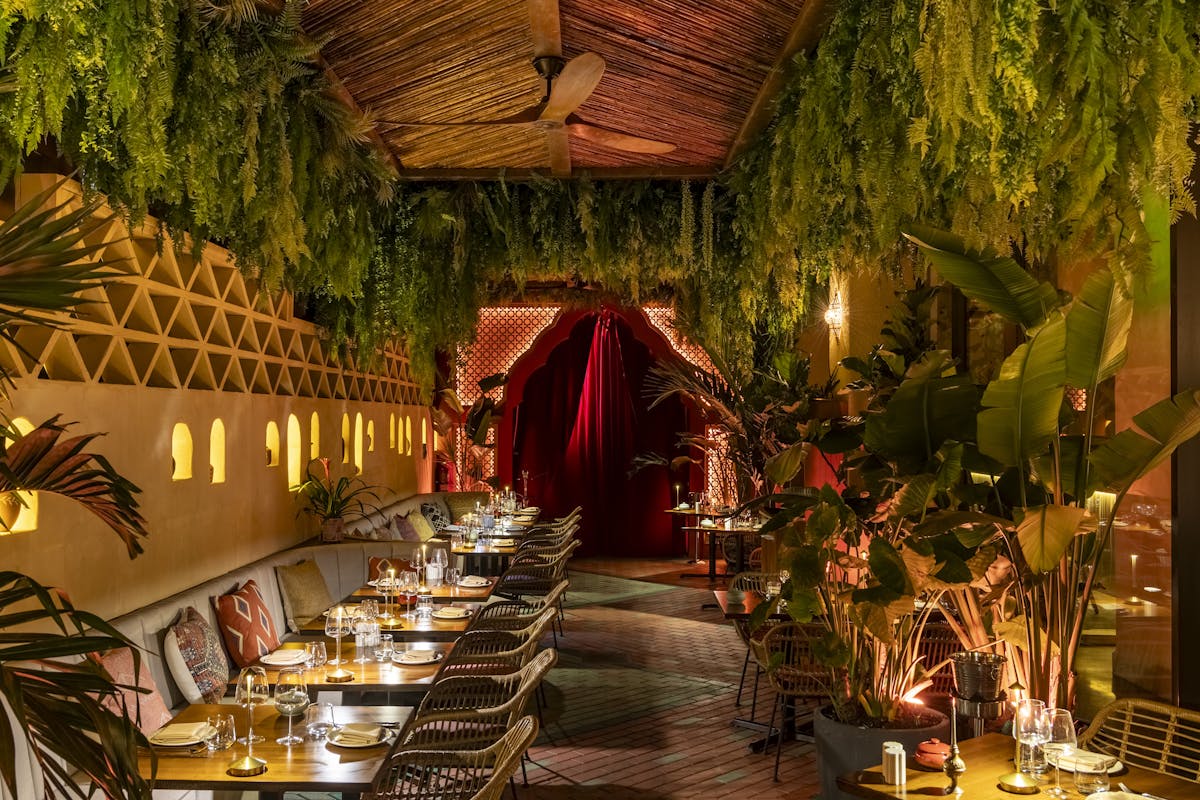 a dining table next to a christmas tree