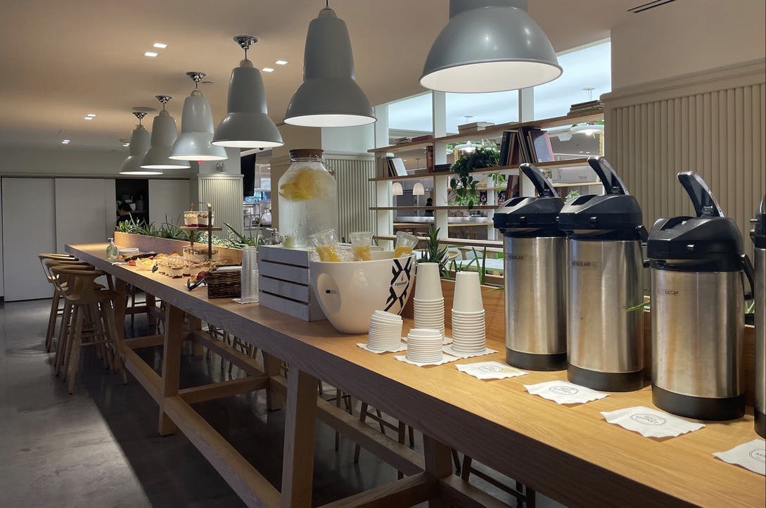 a kitchen with an island in the middle of a table