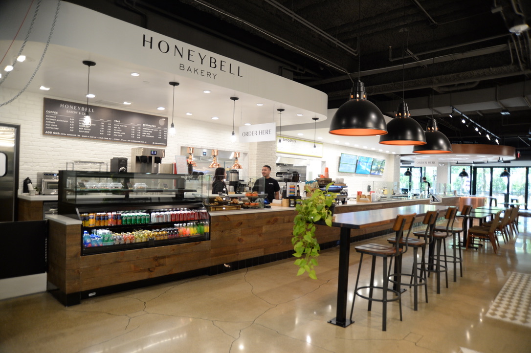 a room with people sitting at a table in a restaurant