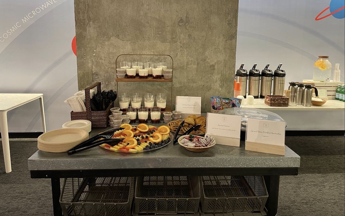 a table topped with plates of food on a counter