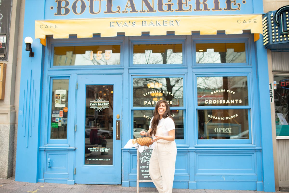 a person standing in front of a store window