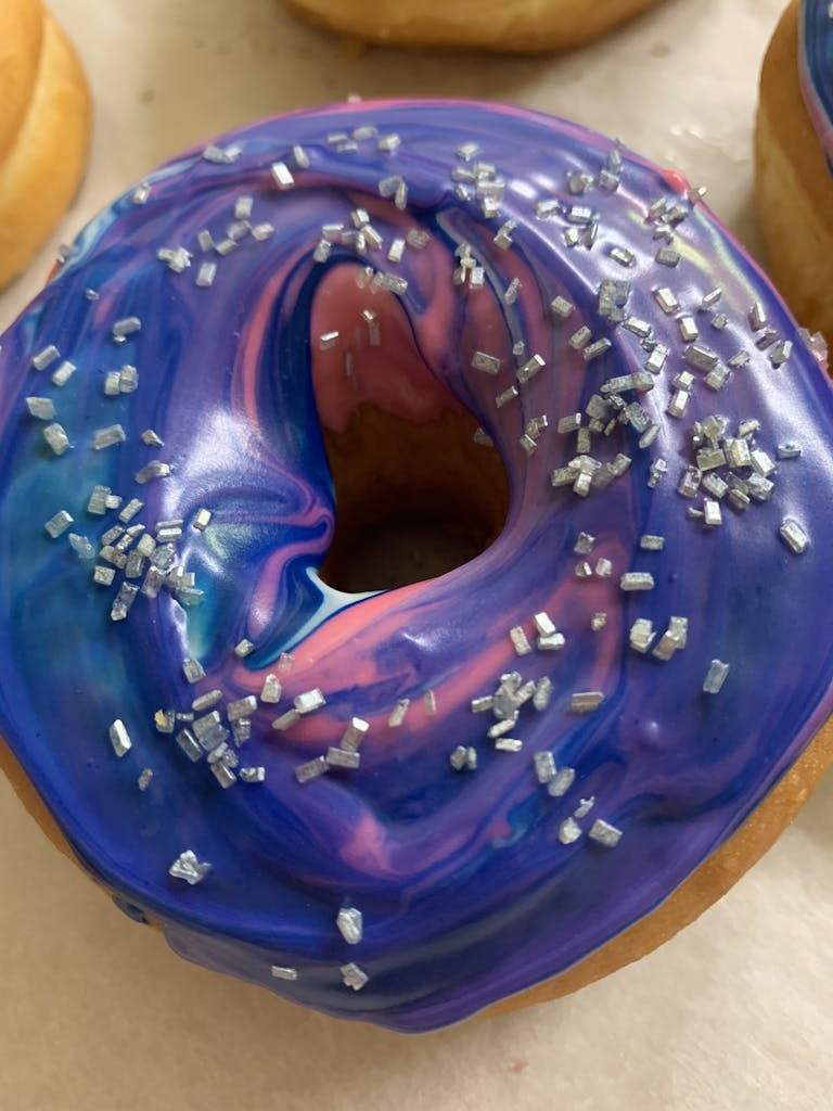 a doughnut sitting on top of a blue plate