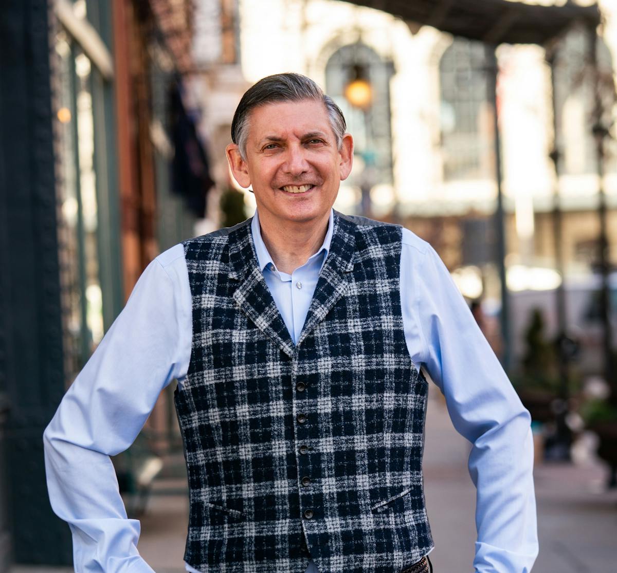 Michael DeGano standing in front of a building