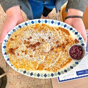 a person holding a plate of food