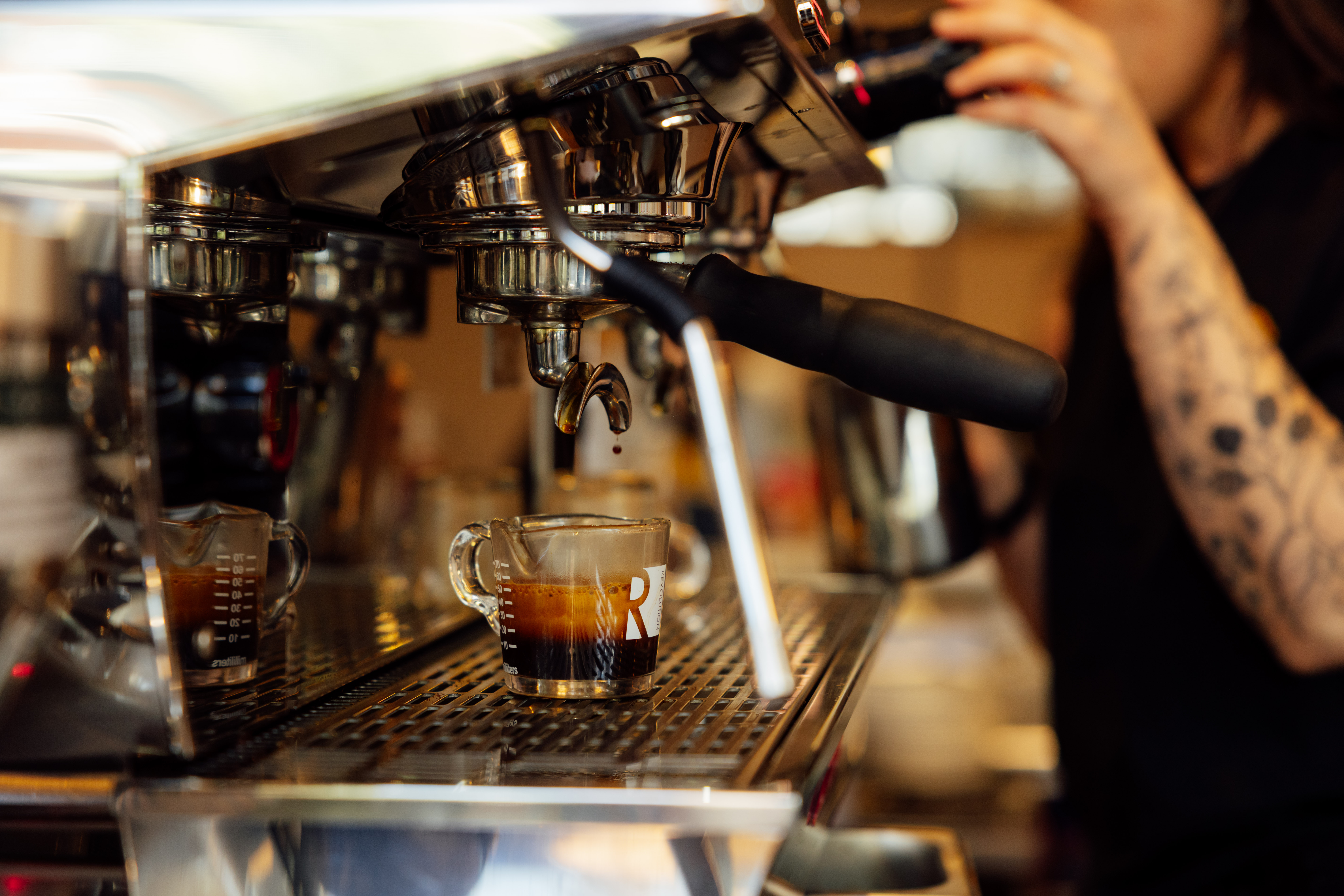 a coffee machine with a cup of coffee