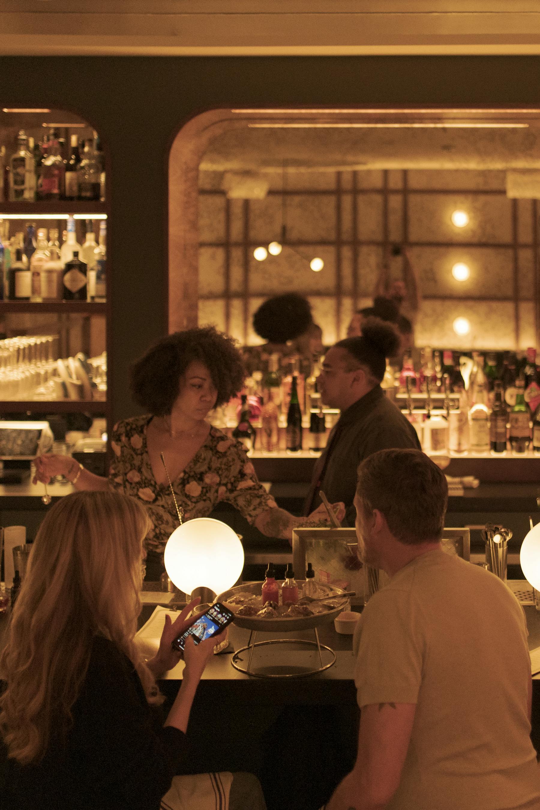a group of people looking at a bar