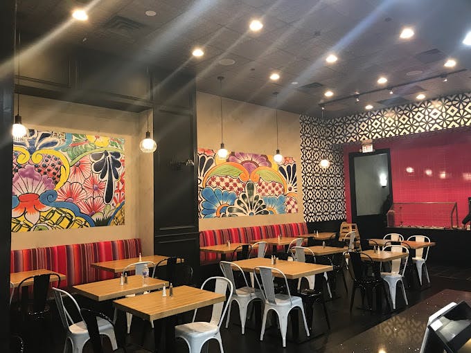 a room filled with furniture and a table in a restaurant