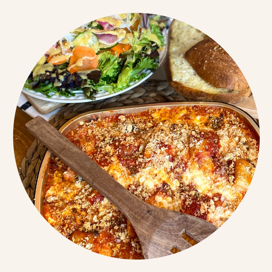 a plate of food with a slice of pizza