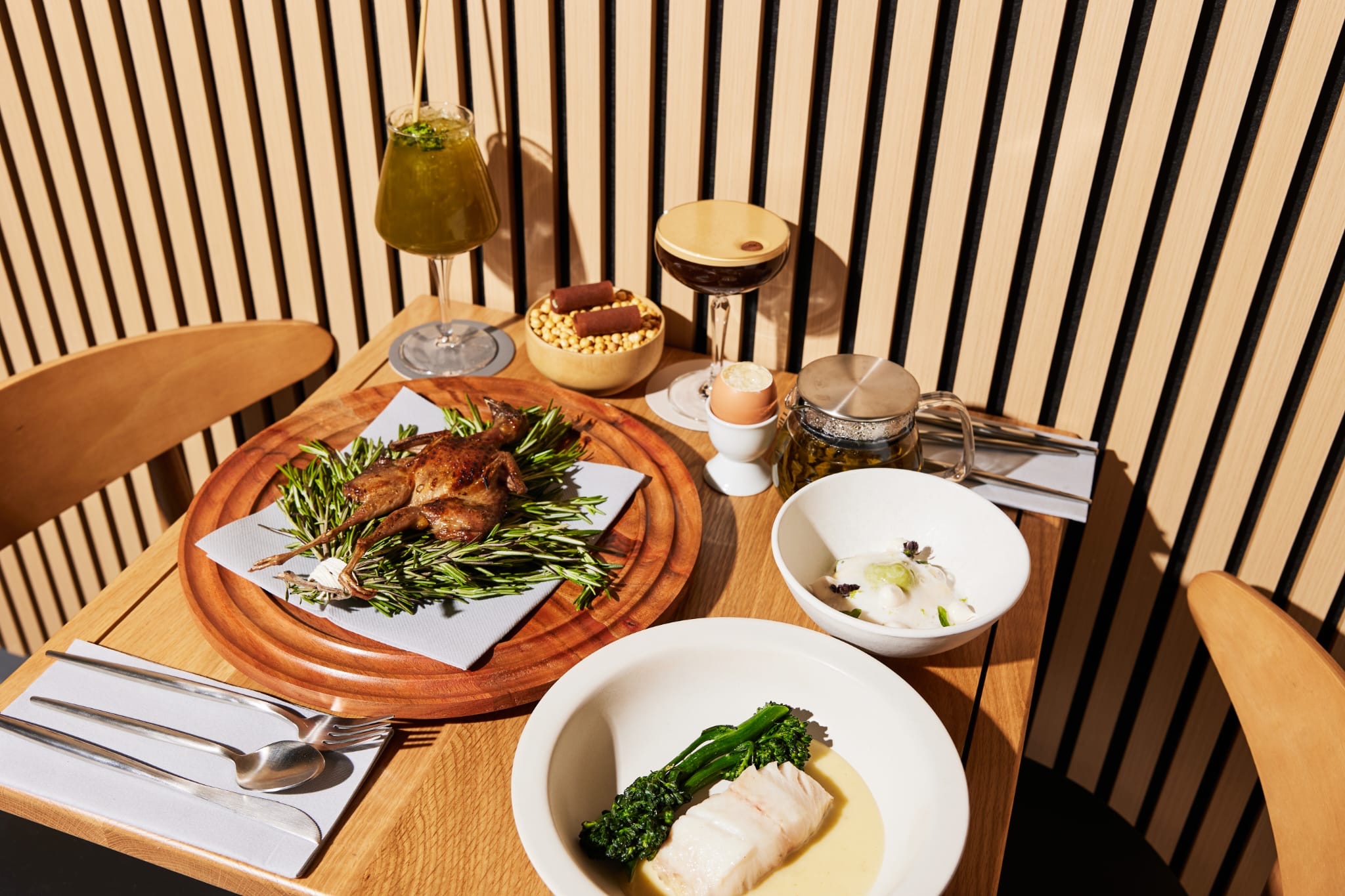 a plate of food sitting on top of a wooden table