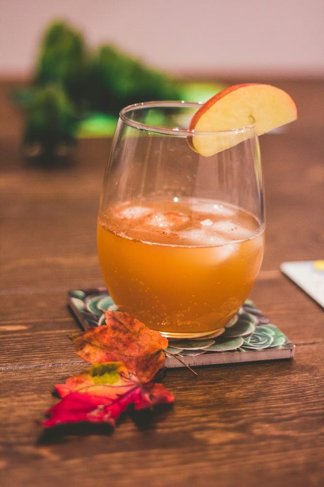 Refreshing cold rum cocktails with autumn garnish