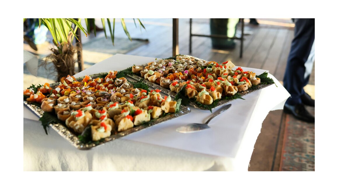 Corporate work event with catered buffet and employees networking over food