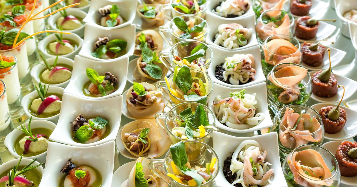 Gourmet bespoke catering appetizers and canapés arranged beautifully on a table