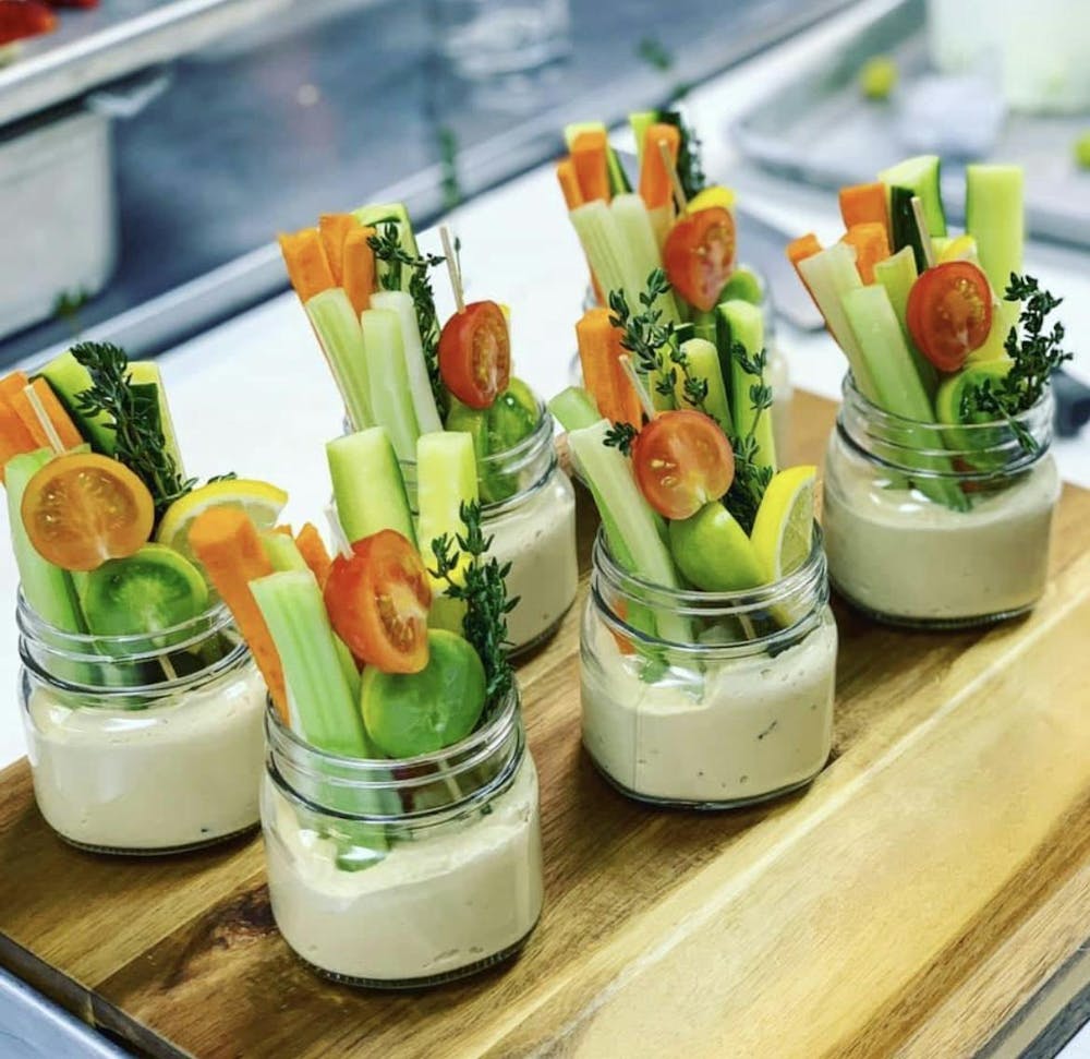 Mason jars of vegetables as a result of vegan catering.