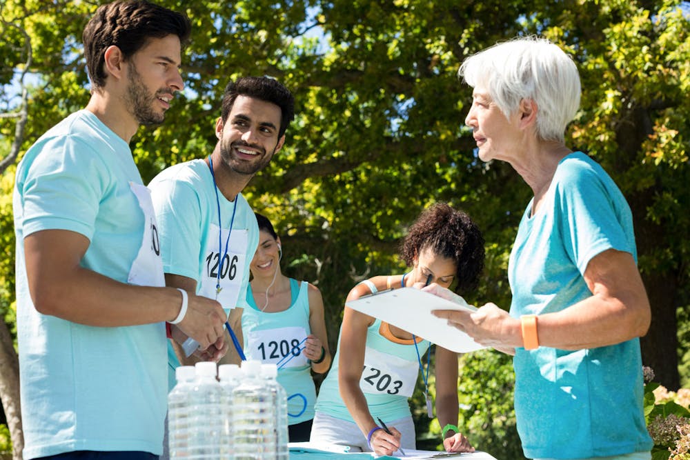 Employees with water bottles during a run for charity event