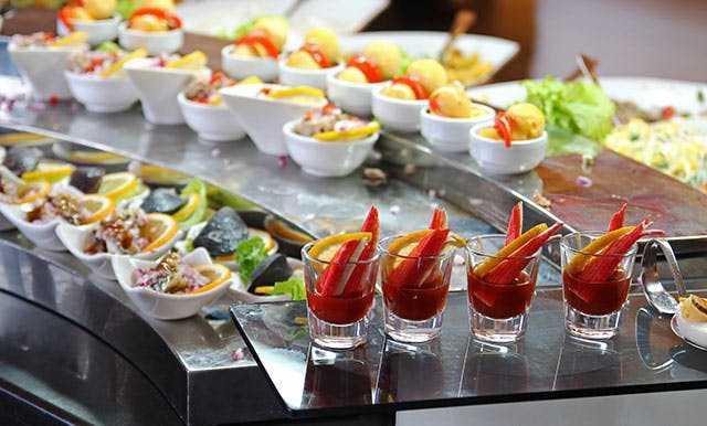 Assorted gourmet appetizers and small bites served at cocktail hour catering station