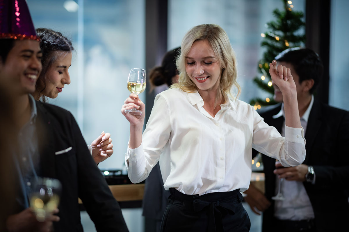Woman dancing at a company corporate event.