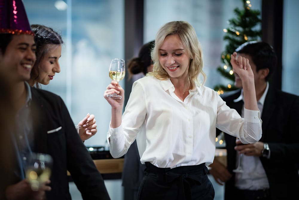 Woman dancing at a company corporate event.
