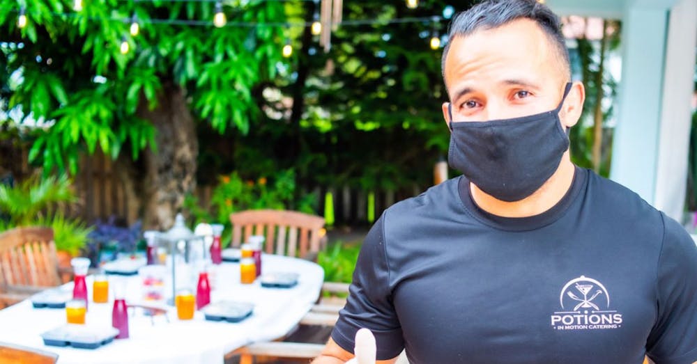 Professional bespoke catering staff serving guests at a private event in South Florida