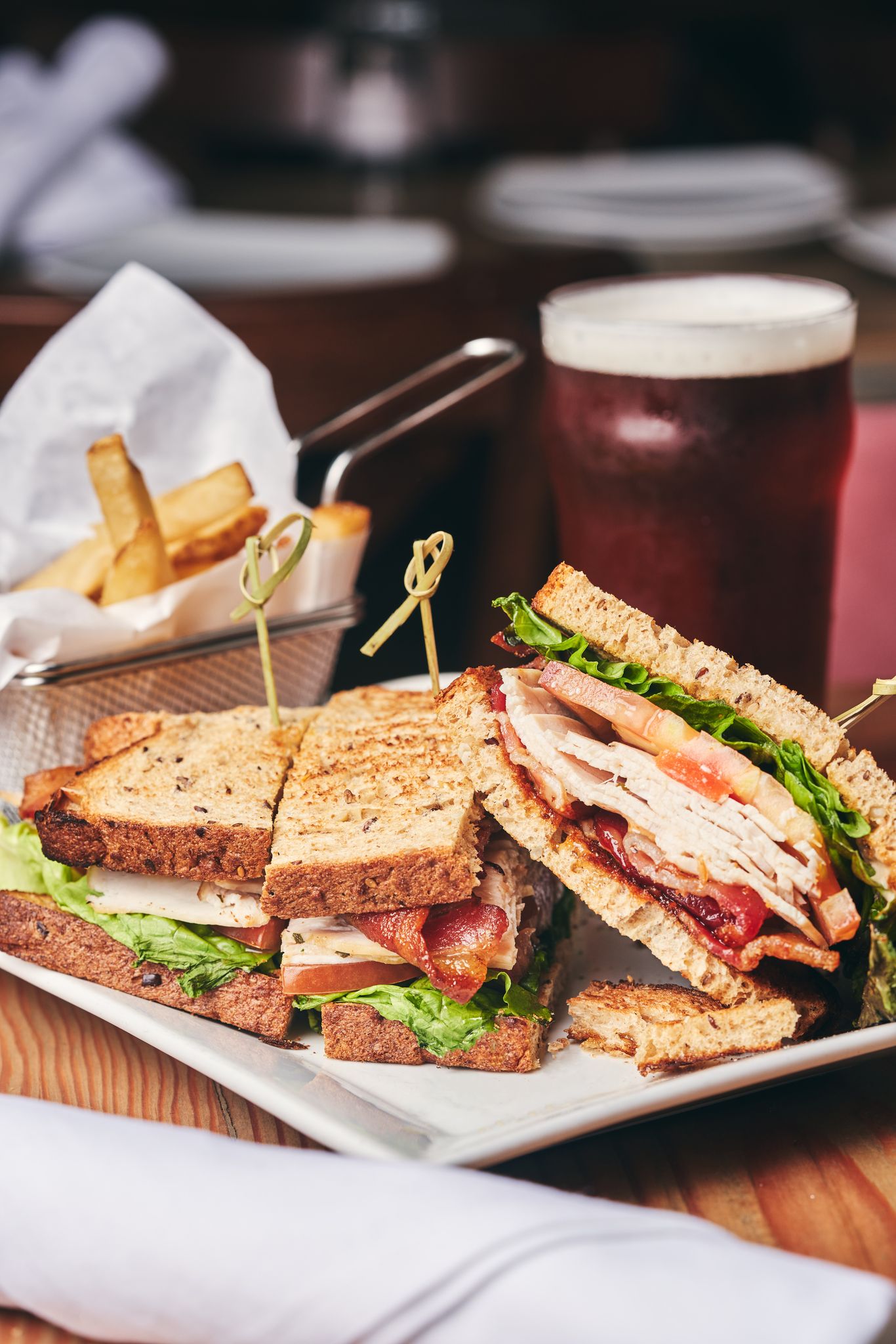 a sandwich cut in half on a plate on a table