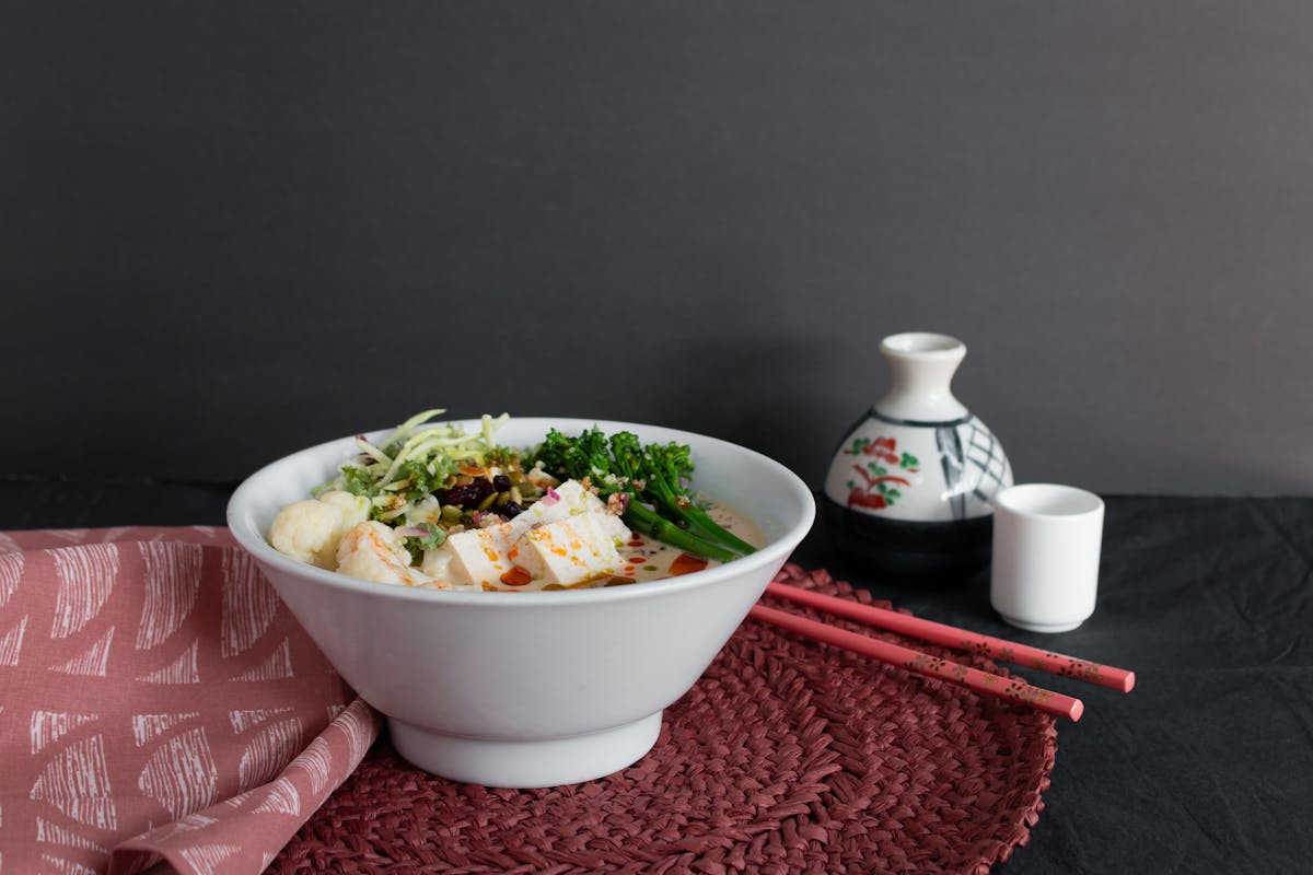 a bowl of food sitting on a table