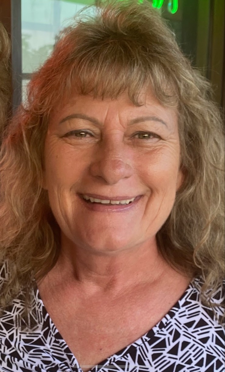 a woman smiling for the camera