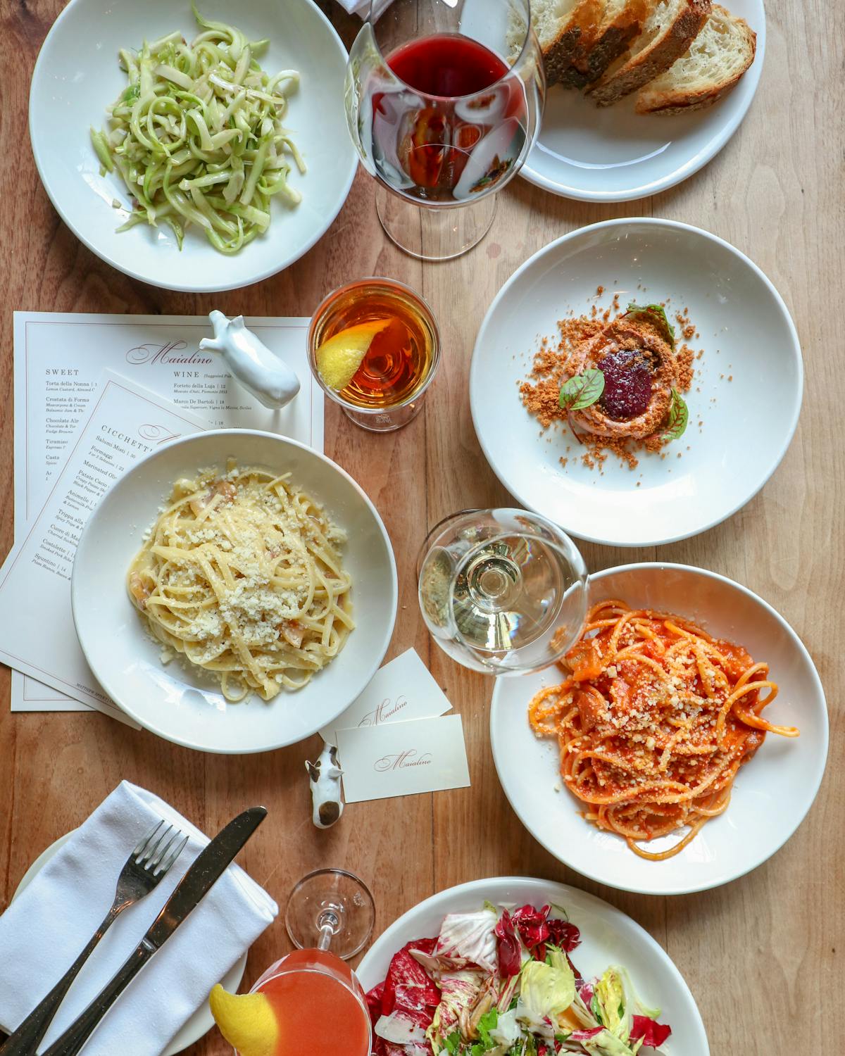 a table full of Italian dishes at Maialino, one of Eater's top Italian restaurants