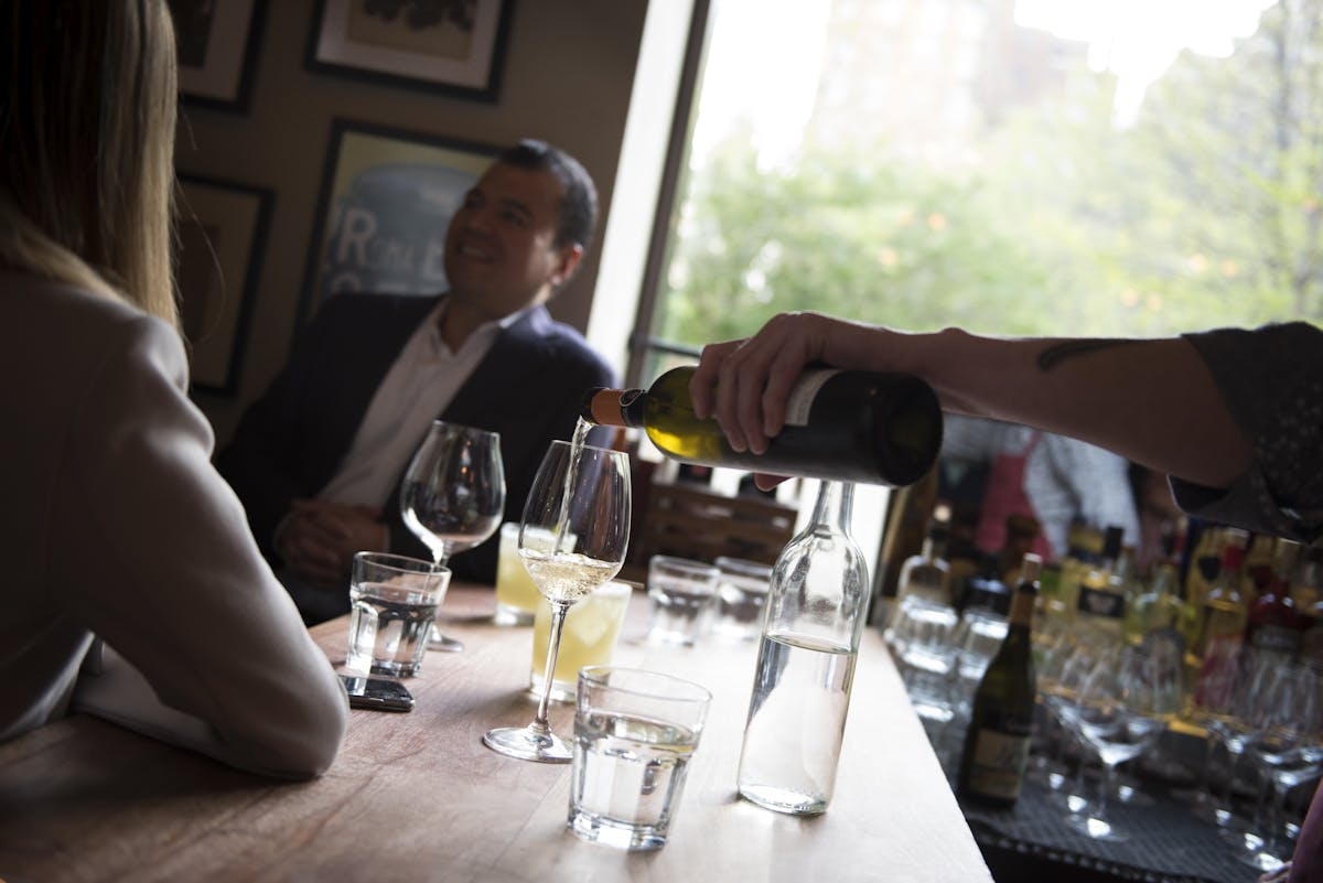 pouring wine at the Maialino bar